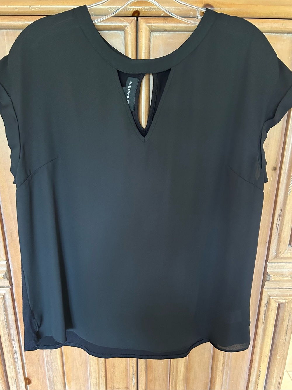 Black short sleeve mixed media blouse, curved shirt tail hem, size L